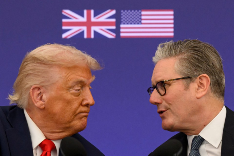 Donald Trump and Keir Starmer talking, with the Union Jack and US flags in the background.