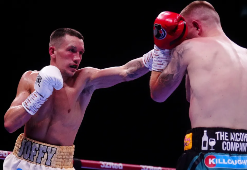 Boxer Joffy hitting an opponent in the head.