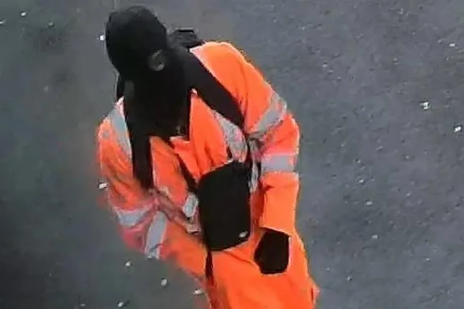 Manhunt for gunman as CCTV released of masked man in ‘distinctive’ bright orange hi-vis outfit & carrying backpack