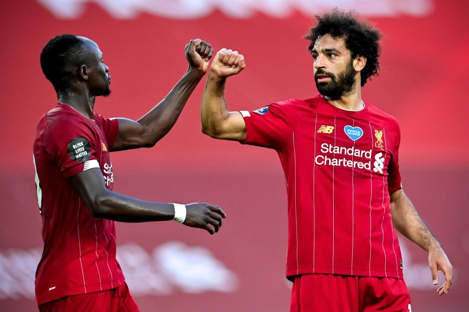 Mohamed Salah and Sadio Mané celebrating a goal.