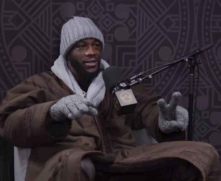 Deontay Wilder speaking into a microphone.