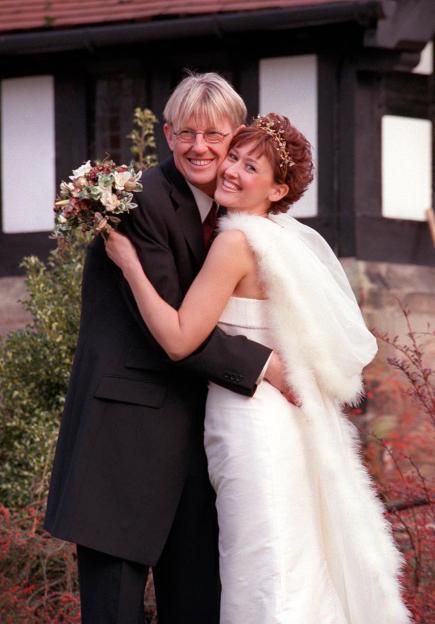 Kevin Kennedy as Curly Watts and Angela Lonsdale as Emma Taylor on their wedding day.