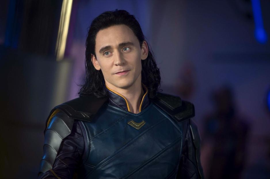 Loki in his blue and gold costume with a slight smile.