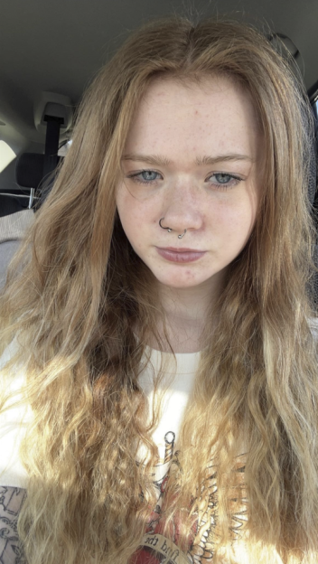 Morgan McCormick, a young woman with long blonde hair, blue eyes, and a nose ring, looks at the camera.