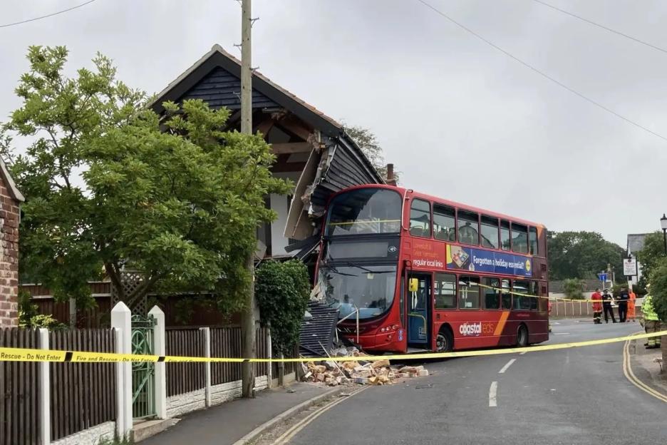 Double-Decker Bus Crashes into House: Shocking Images Show Debris Scattered Across the Road
