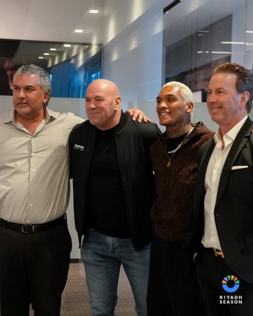 Four men posing for a photo.