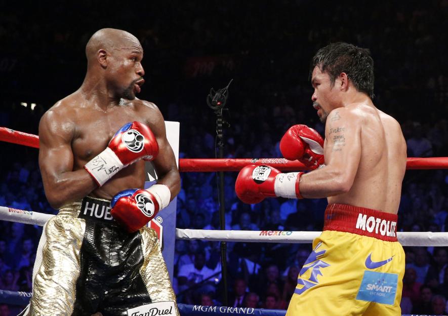 Floyd Mayweather Jr. and Manny Pacquiao exchange punches during their welterweight unification championship boxing bout.