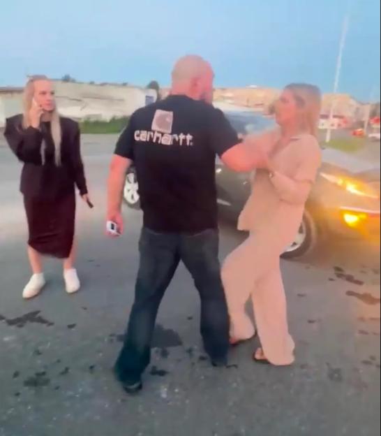 Russian motorists fight at petrol stations amidst growing fuel crisis caused by Ukrainian strikes on Vladimir Putins oil refineries. A thuggish man hits a woman in Serov, Sverdlovsk region.