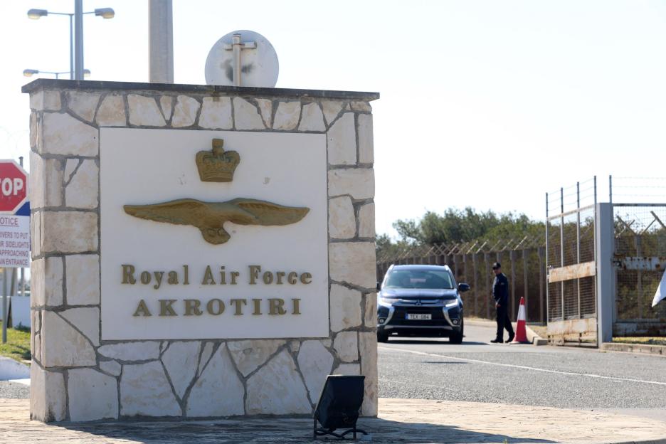 The entrance sign for Royal Air Force Akrotiri, with a car approaching the gate.