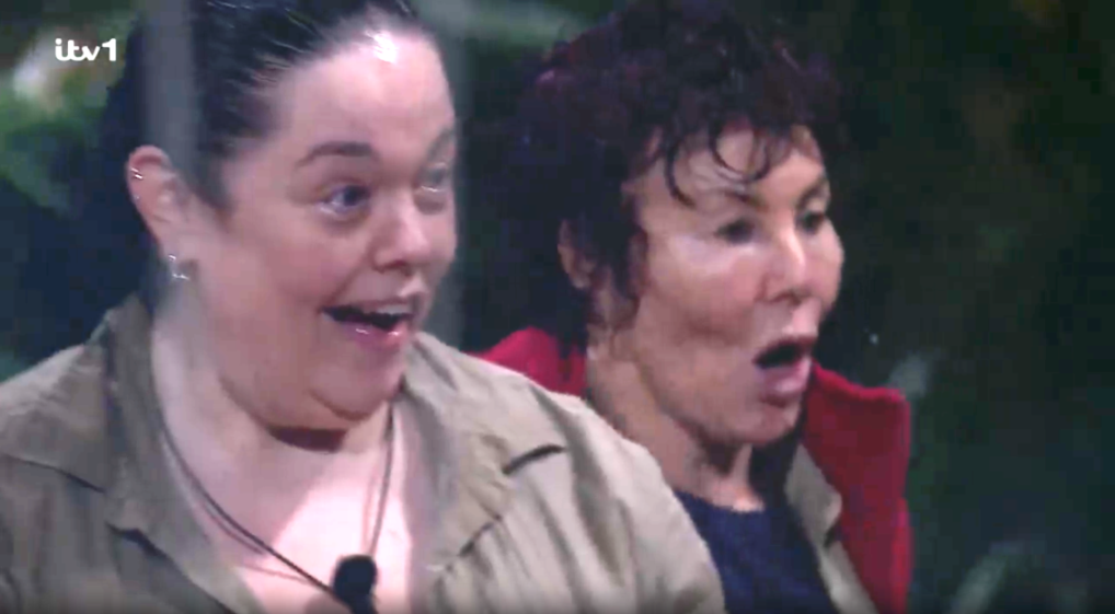 Two women with surprised expressions, mouths agape, looking off-screen.