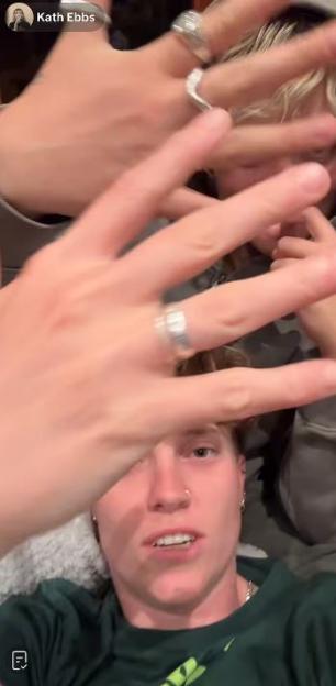 Kath Ebbs showing off multiple rings on their fingers.