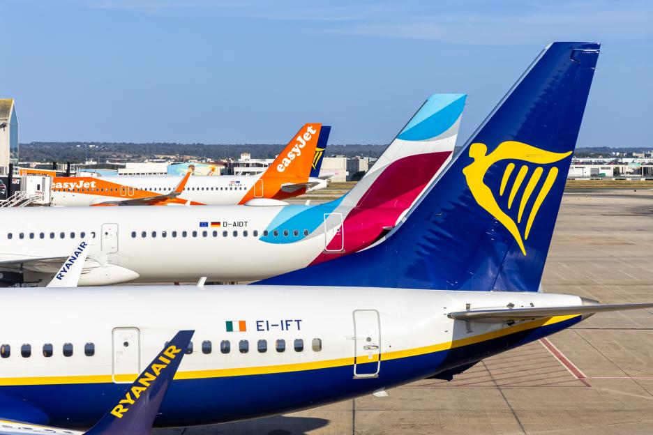Ryanair, Eurowings, and EasyJet airplanes parked at Palma de Mallorca airport.