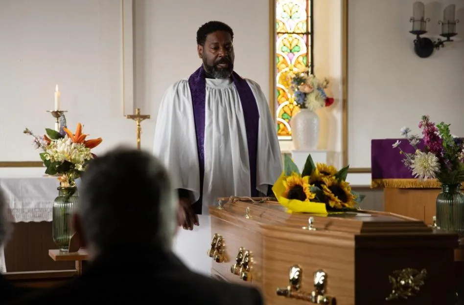 Charles Anderson leads the funeral service for Ethan at the church.