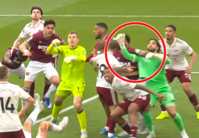 Football players from two teams clashing on the field, with a red circle highlighting two players in the center of the scuffle.