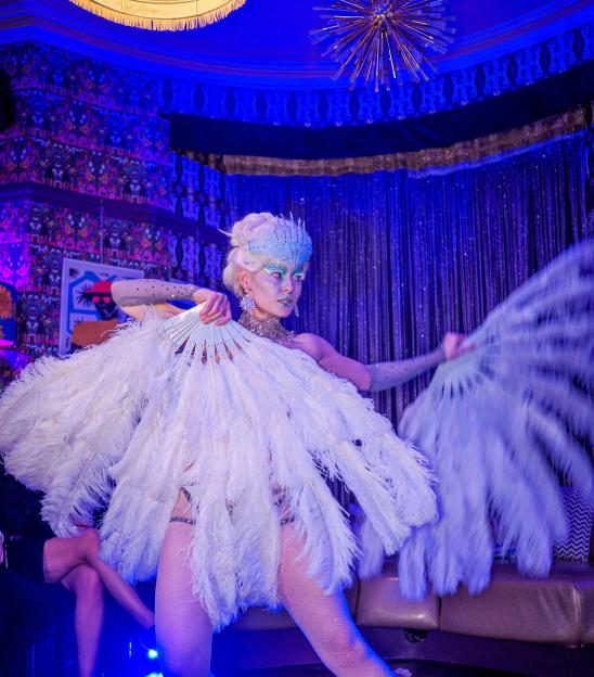 Performer Fae Wildefyre putting on a show for guests.