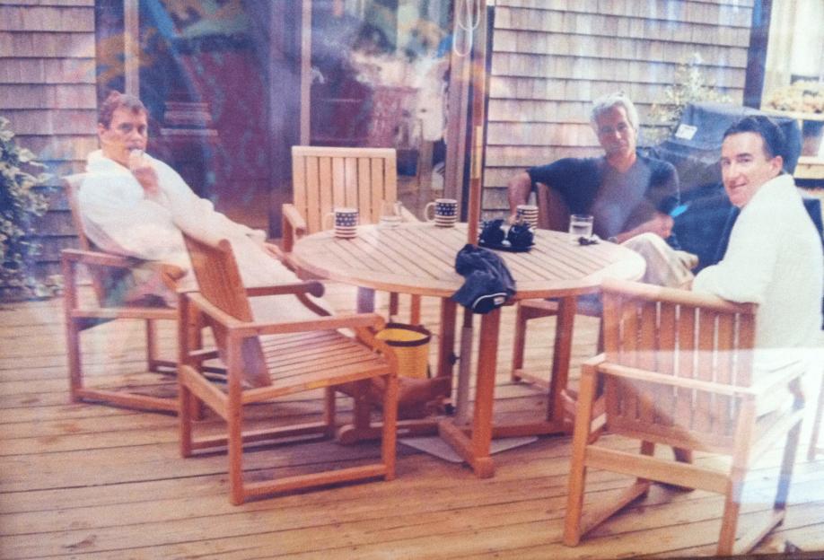 Jeffrey Epstein sitting with Andrew Mountbatten-Windsor and Peter Mandelson on a deck.