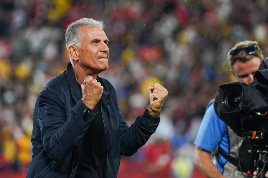 A man with gray hair clenches his fists in excitement during the Ghana v Panama 2026 FIFA World Cup Group L match in Toronto.