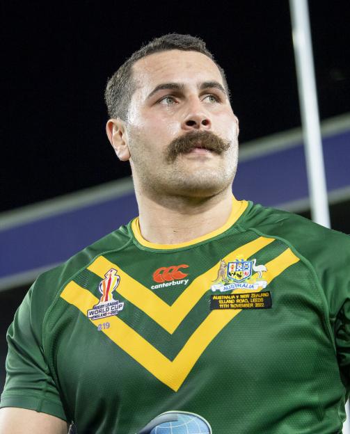 Reagan Campbell-Gillard in an Australia rugby league uniform, featuring the Rugby League World Cup 2021 emblem.
