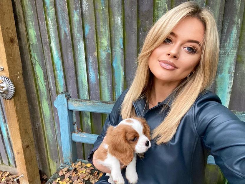 Emily Atack holding her tiny puppy, Penny, on an afternoon stroll.