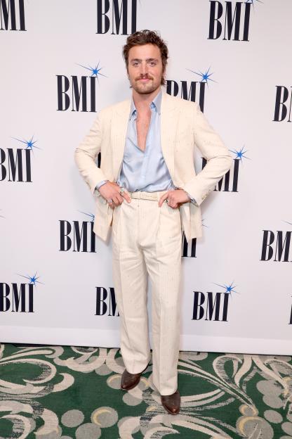 Benson Boone posing on the red carpet at the BMI Pop Awards.