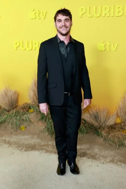 RJ Mitte attending the world premiere of "Pluribus" in a black suit.