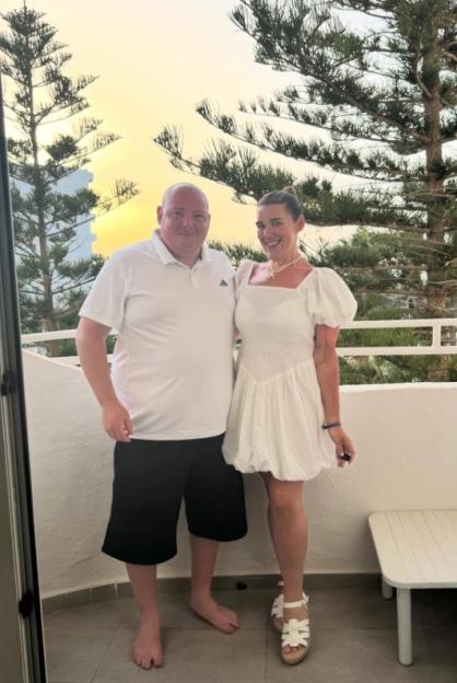TikTok star Becki Jones and her boyfriend on a balcony.