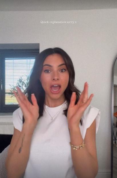 Paige Thorne of Love Island appearing surprised with hands raised.