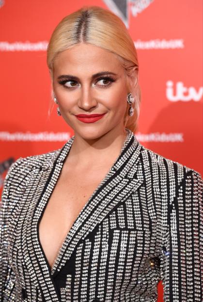 Pixie Lott attends a photocall for "The Voice Kids" in a sparkly blazer.