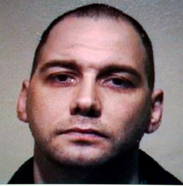 Mugshot of Peter Voisey, 54, with short hair and a black collared shirt.