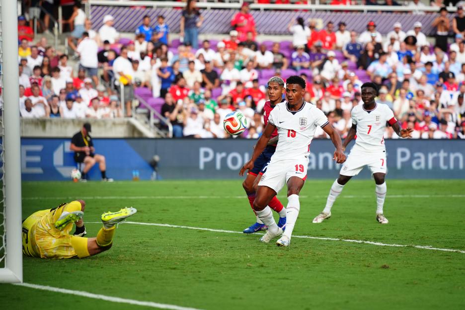 England's Ollie Watkins scoring a goal during a soccer match.