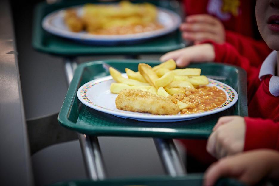 School dinners fish chips and beans on a plate