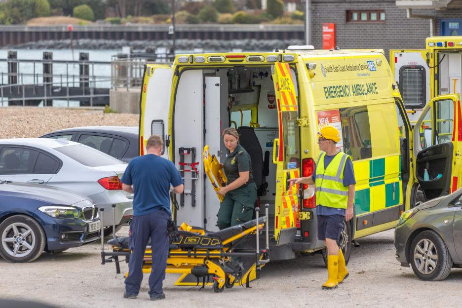 Medical personnel working next to an ambulance at Shoreham.