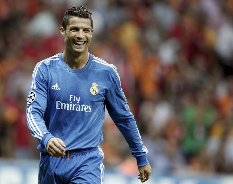 Real Madrid's Ronaldo smiles after scoring a goal against Galatasaray during their Champions League soccer match in Istanbul