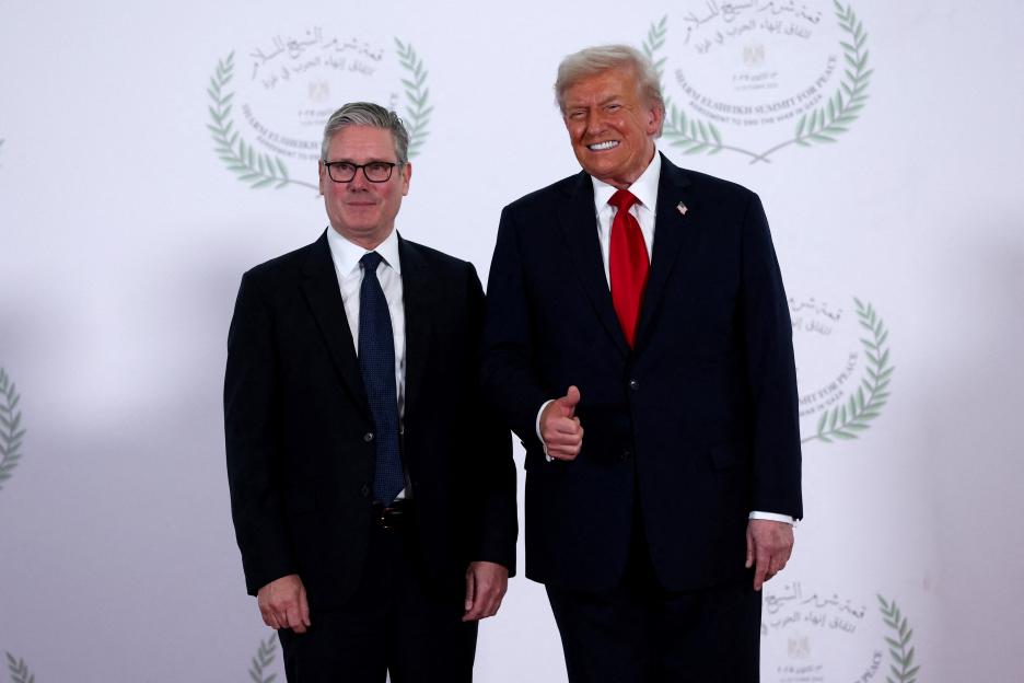 U.S. President Donald Trump and British Prime Minister Keir Starmer posing for a photo at a world leaders' summit in Sharm El-Sheikh, Egypt.