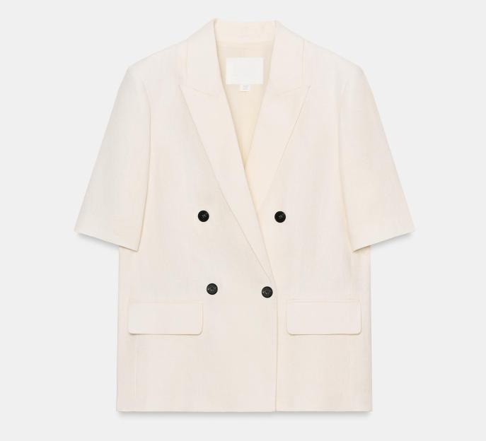 Cream short-sleeved double-breasted blazer with four black buttons and two front pockets.