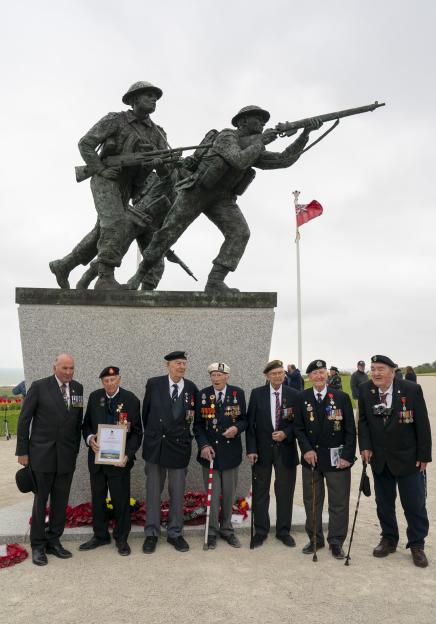 D-Day veterans Ken Hay, Jack Quinn, Henry Rice, Alec Penstone, Reg Pye, Stan Ford, and Richard Aldred at the British Normandy Memorial Gold Beach.