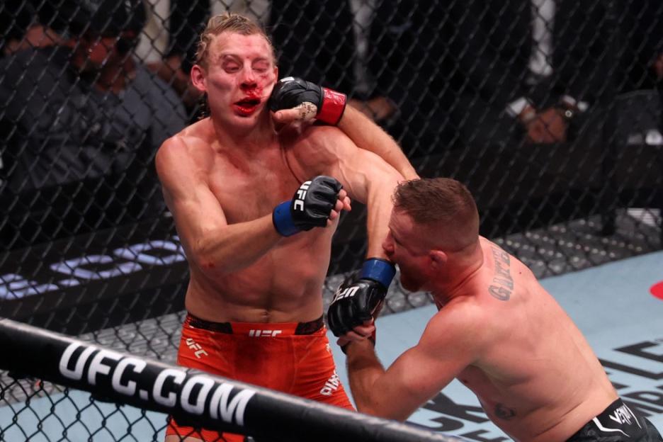 UFC fighter Gaethje punching Pimblett in the face during their fight.