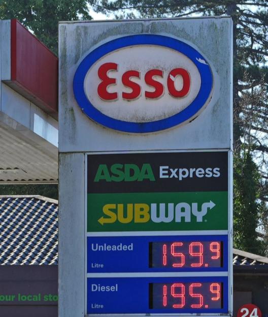 An Esso petrol station in Maidenhead shows fuel prices, with unleaded at 159.9 and diesel at 195.9.