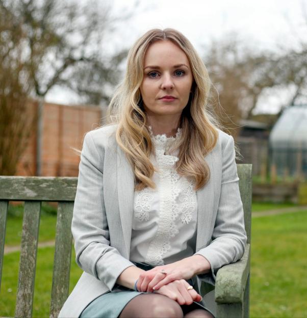 Lissie Harper, PC Andrew Harper's widow, sitting in a garden.