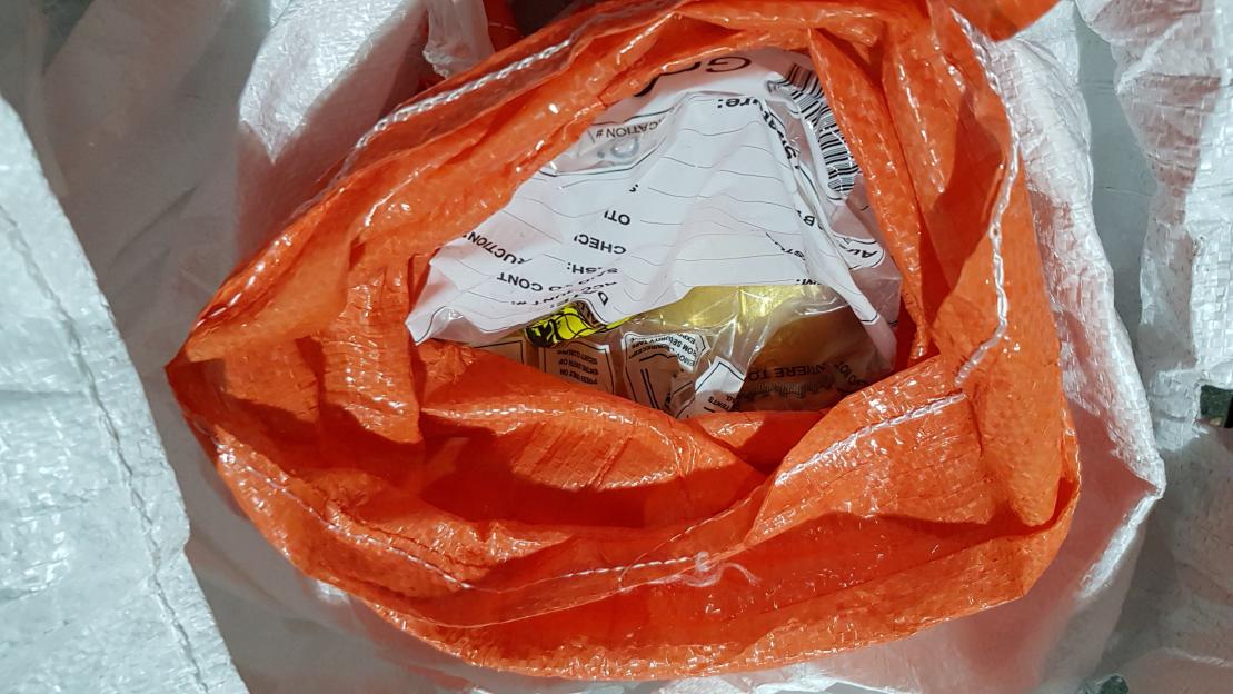 Gold bars inside an orange bag, seized by the National Crime Agency.