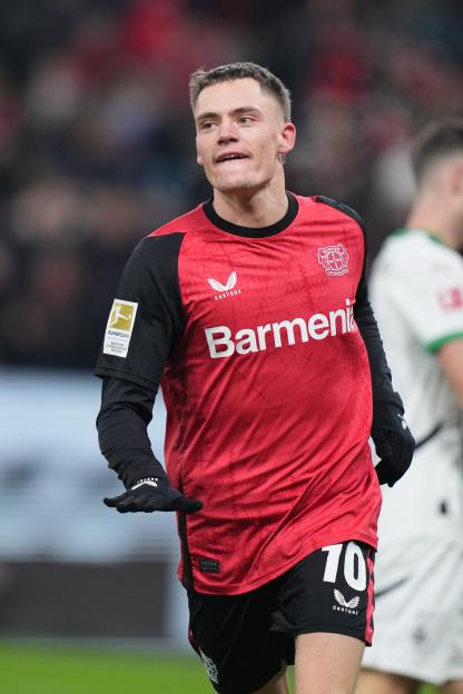 Florian Wirtz of Bayer 04 Leverkusen celebrates after scoring a goal.