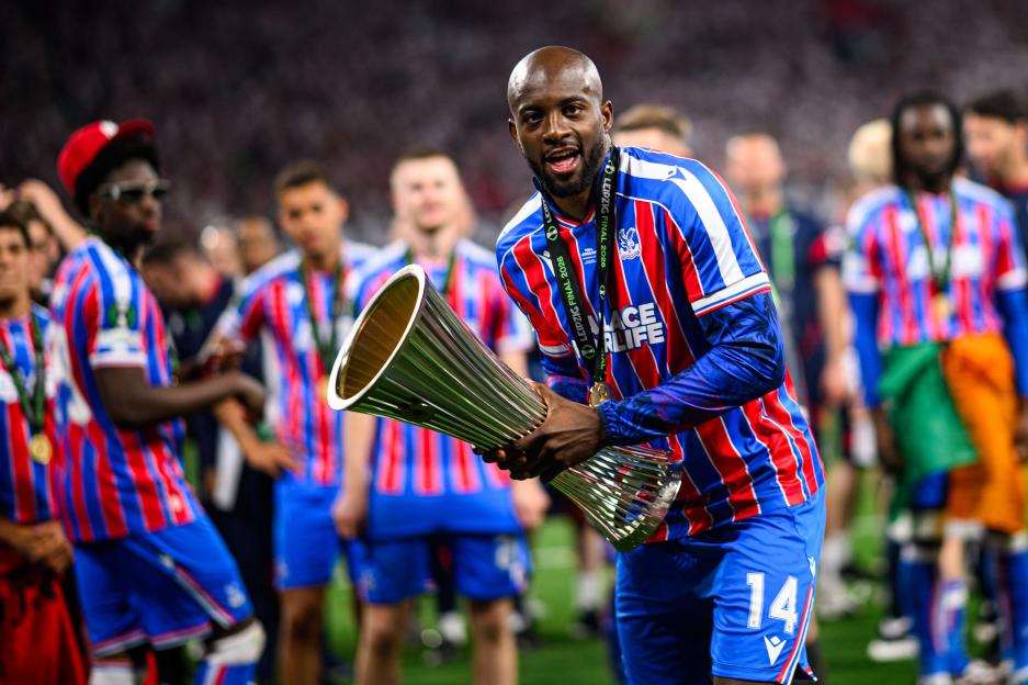 Jean-Philippe Mateta of Crystal Palace holding the UEFA Conference League trophy.