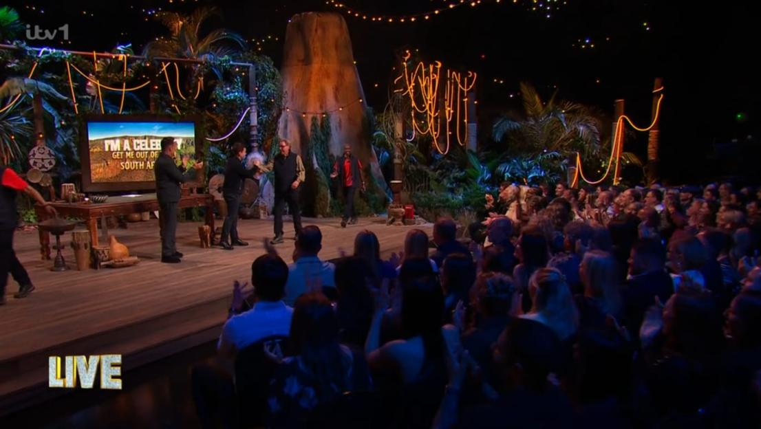 "I'm A Celebrity... Get Me Out Of South Africa" cast members on stage with an audience.