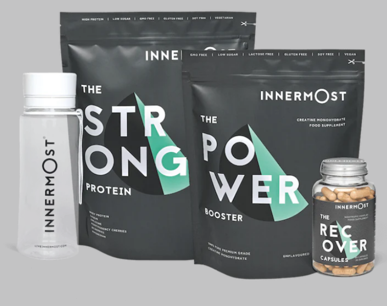 Innermost protein and recovery supplements with a water bottle.
