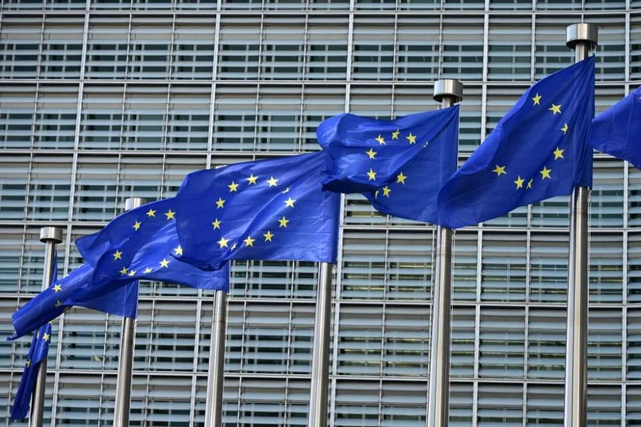 European flags fluttering outside the European Commission headquarters in Brussels.
