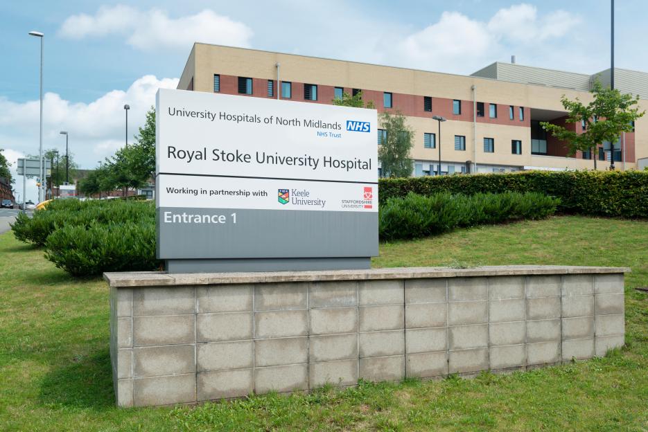 Signage for the Royal Stoke University Hospital located on Newcastle Road in Stoke-on-Trent.