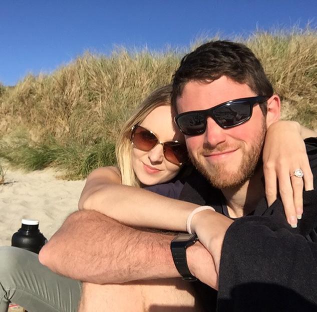 PC Andrew Harper and his wife, Lissie, embracing outdoors.