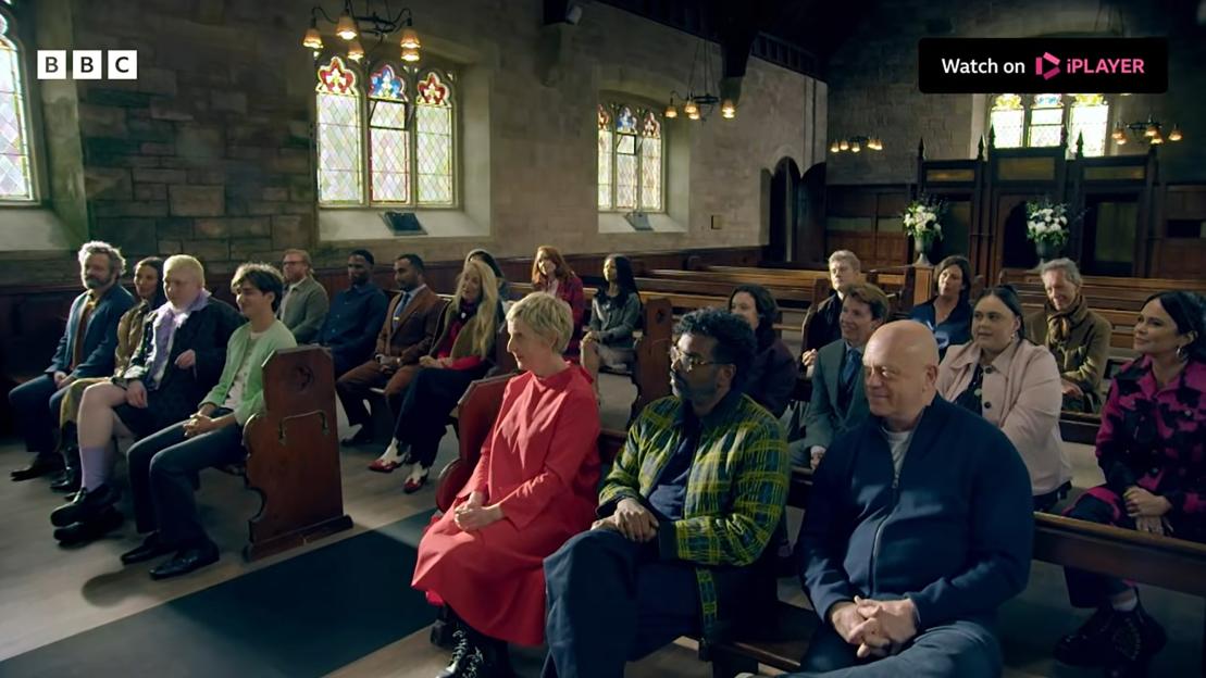 Contestants seated in pews inside a church, from the reality show "Celebrity Traitors."