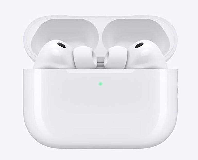 Pair of white AirPods Pro in an open charging case with a green light indicator.