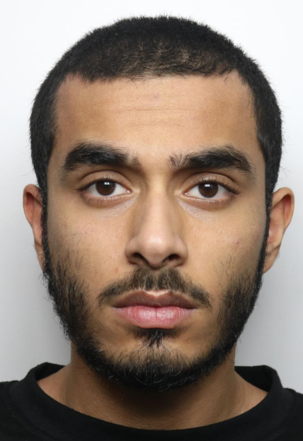 Mugshot of a young man with a beard and short dark hair.